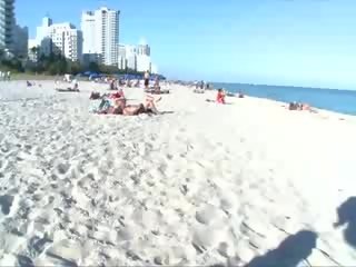 Horny babes suck pussy at beach and cant get enough
